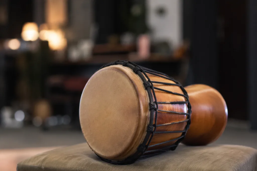 Dundun bass drum from West African ensembles played with wooden sticks to produce deep rhythmic sounds.