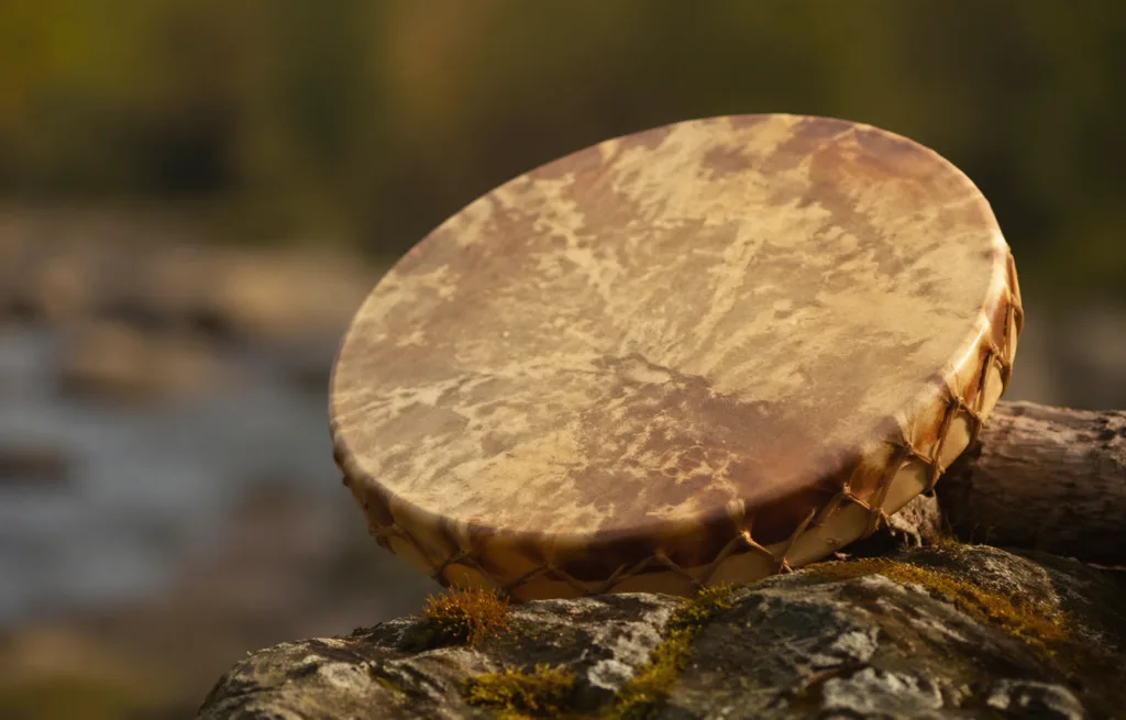 Native American frame drum used in traditional rituals and music for rhythmic sounds and cultural expressions.