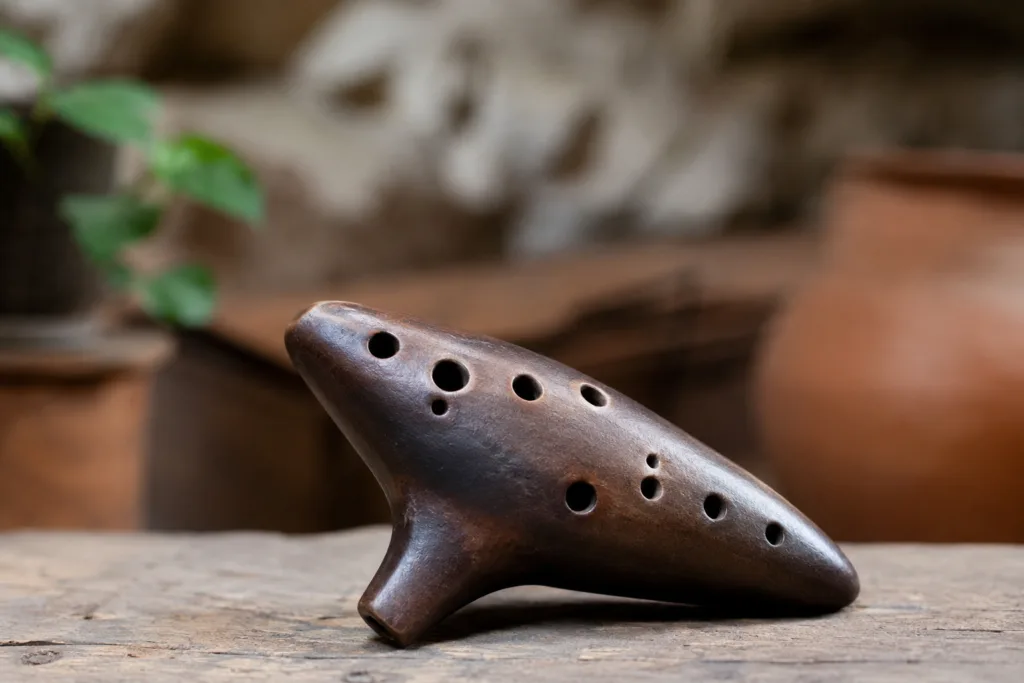 Ocarina instrument showing its distinctive vessel shape and multiple finger holes for playing melodies.