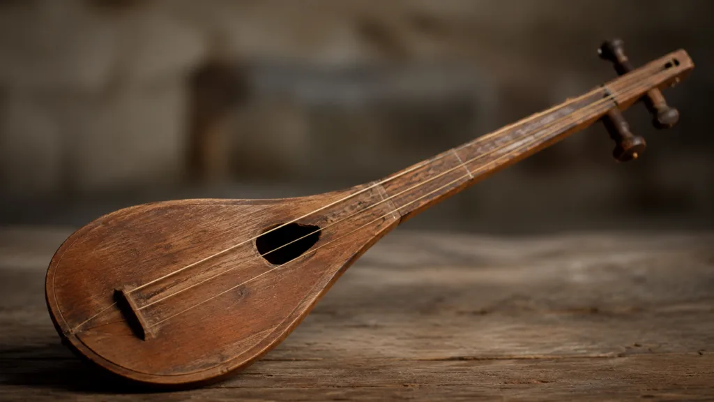 Close-up of a pandura, an ancient Greek three-string lute, showcasing its curved wooden body and traditional design.